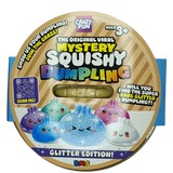 A round cardboard package for a toy product labeled 'The Original Viral Mystery Squishy Dumpling' with 'Glitter Edition!' text. The package shows cartoon dumpling characters in purple, blue, pink, and white, plus a small clear window revealing a yellowish squishy toy inside.